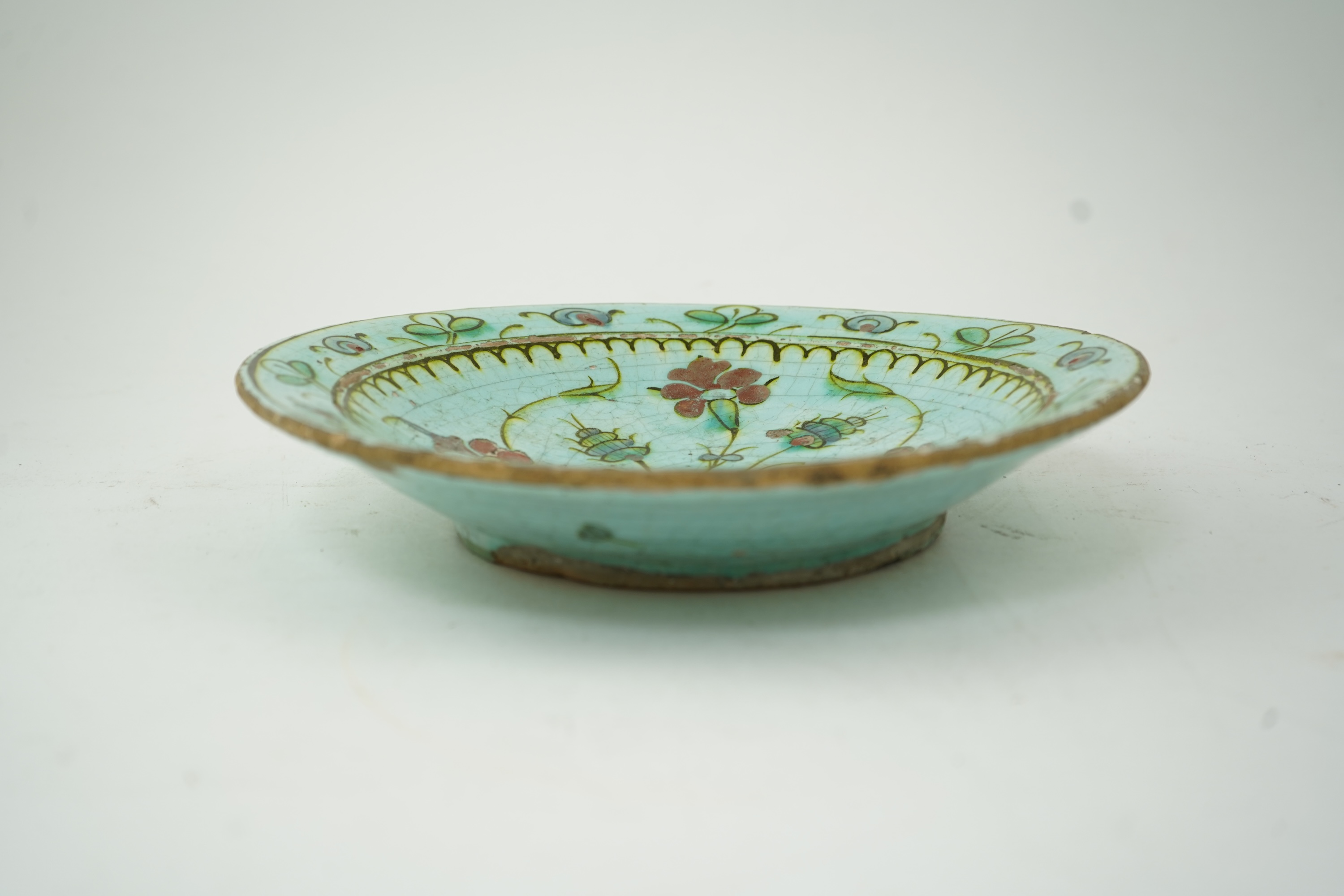 An Iznik pottery turquoise glazed dish, Ottoman Turkey, c.1650-1700